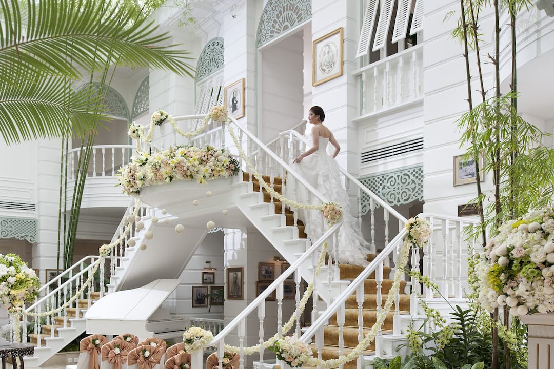Bride going up decorated staircase