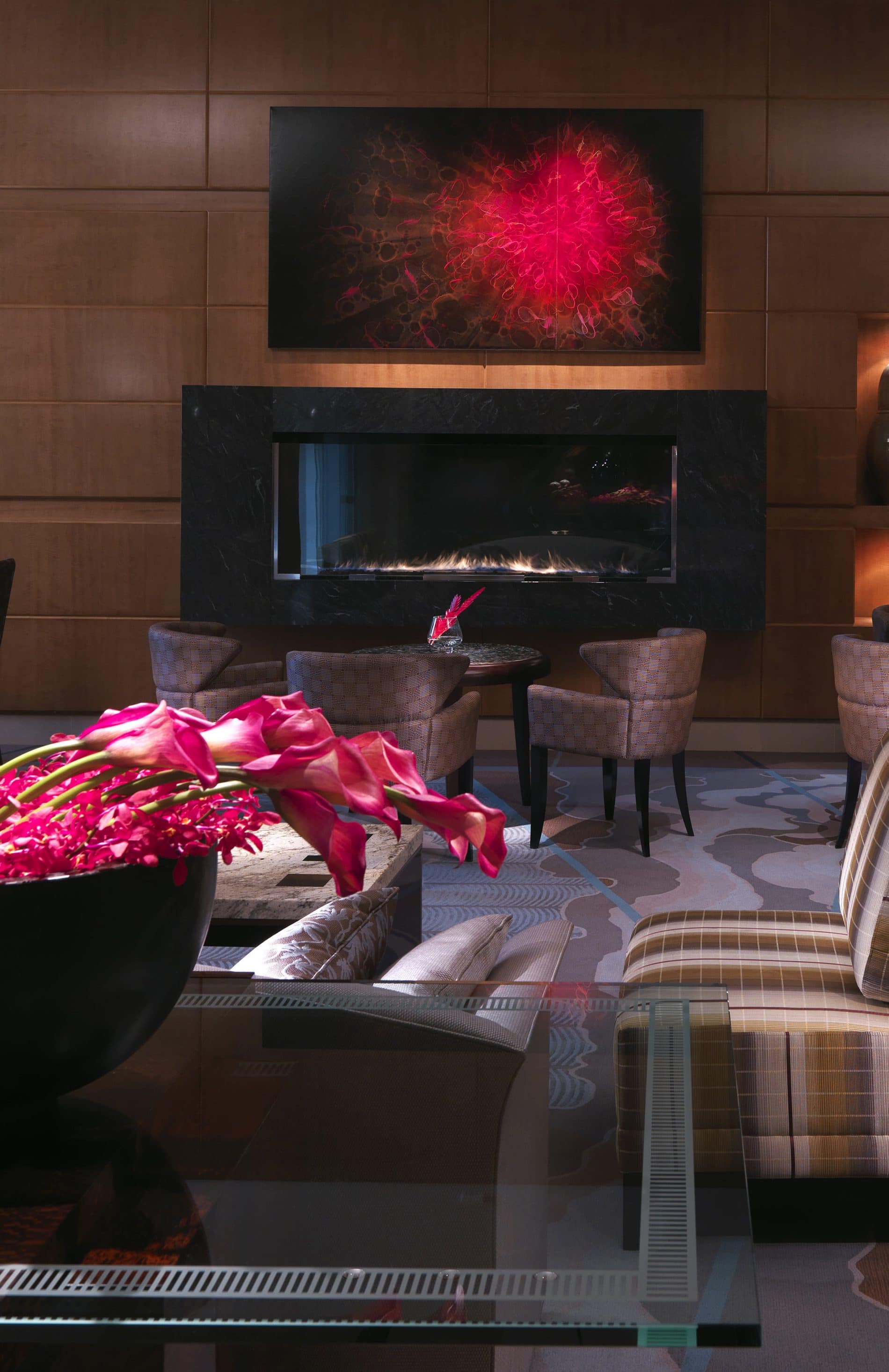 lobby with lounge seating and black fireplace 
