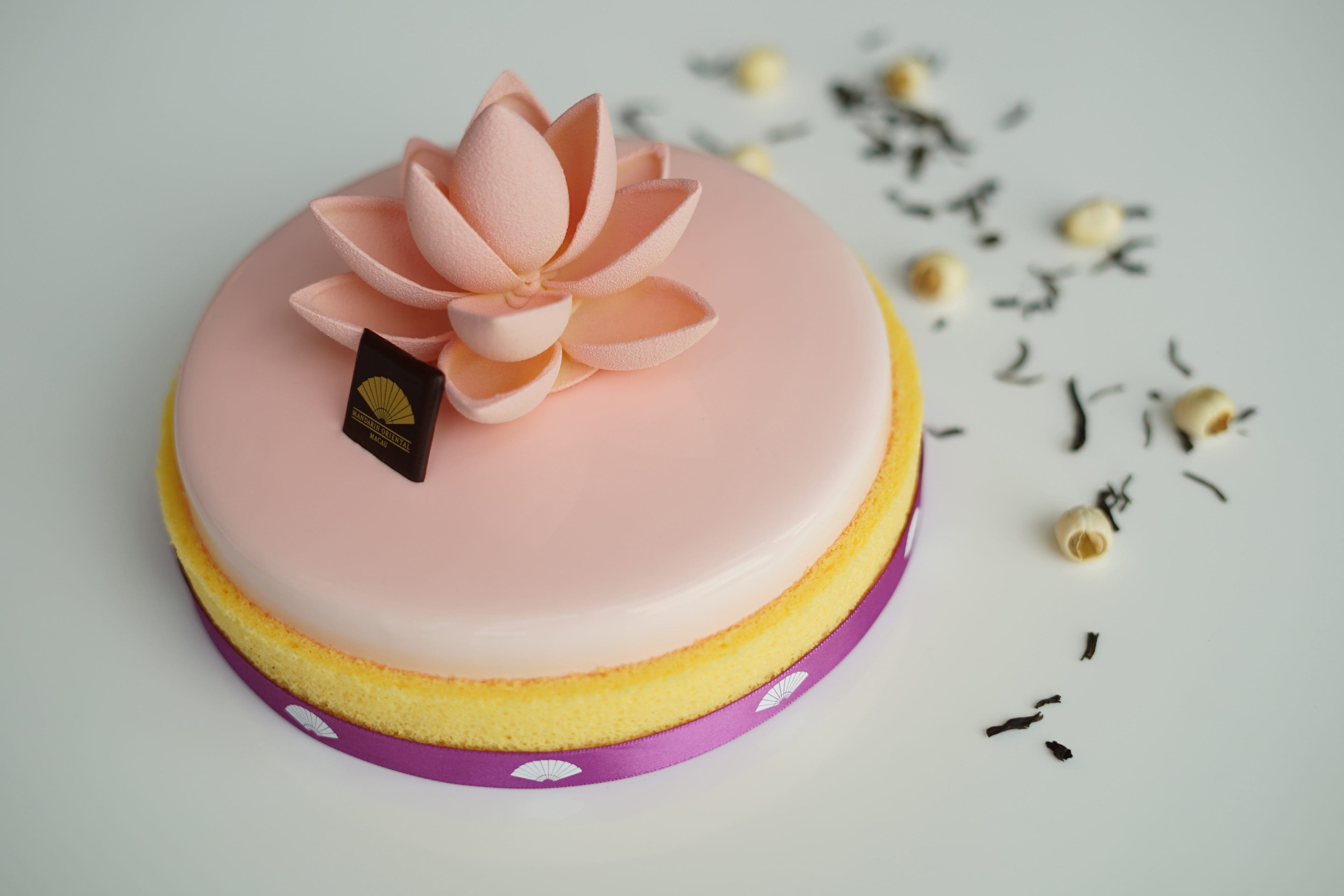 Pink Bloom cake emblazoned with the lotus flower