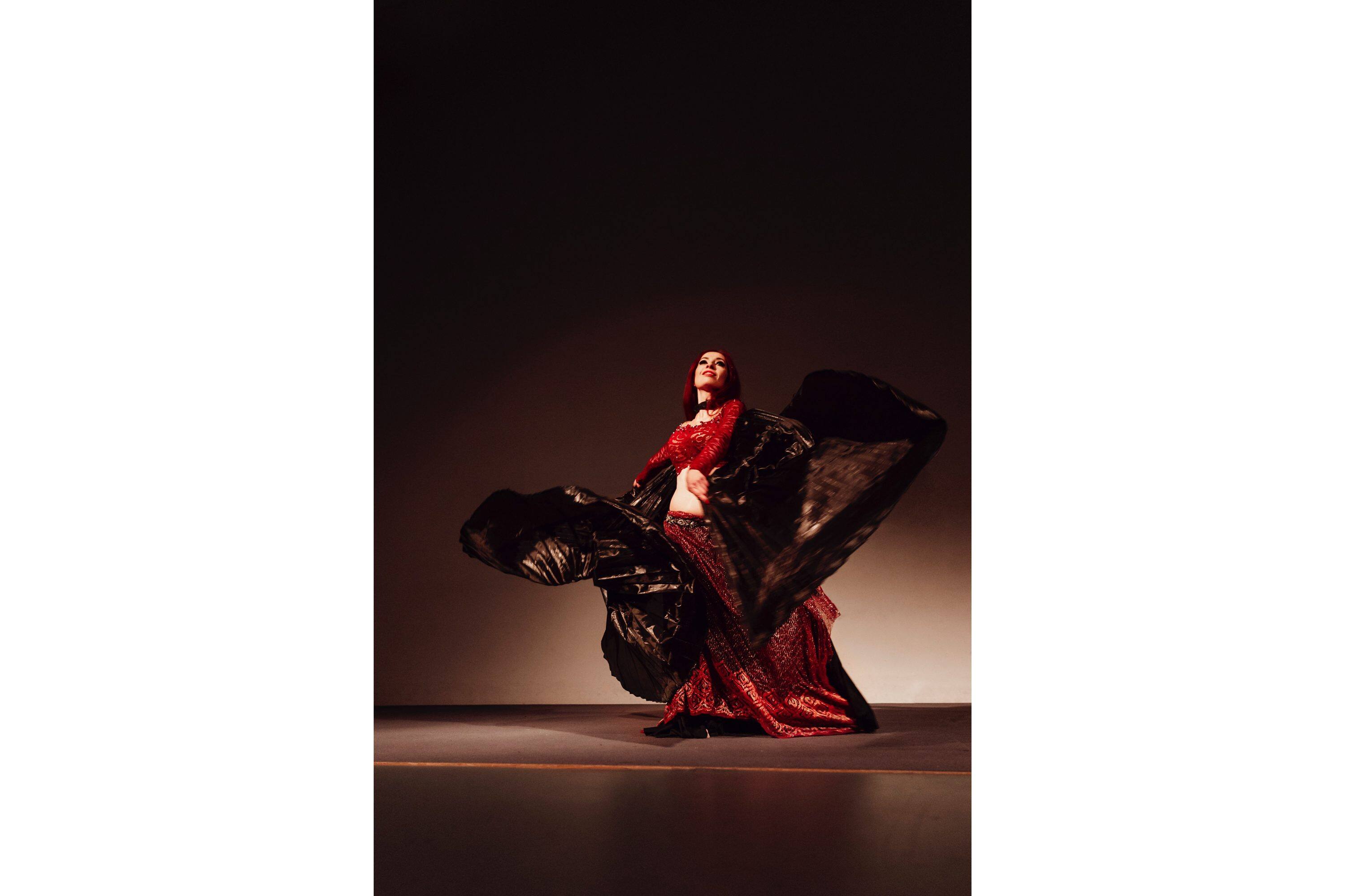 Flamenco dancer swirls on stage