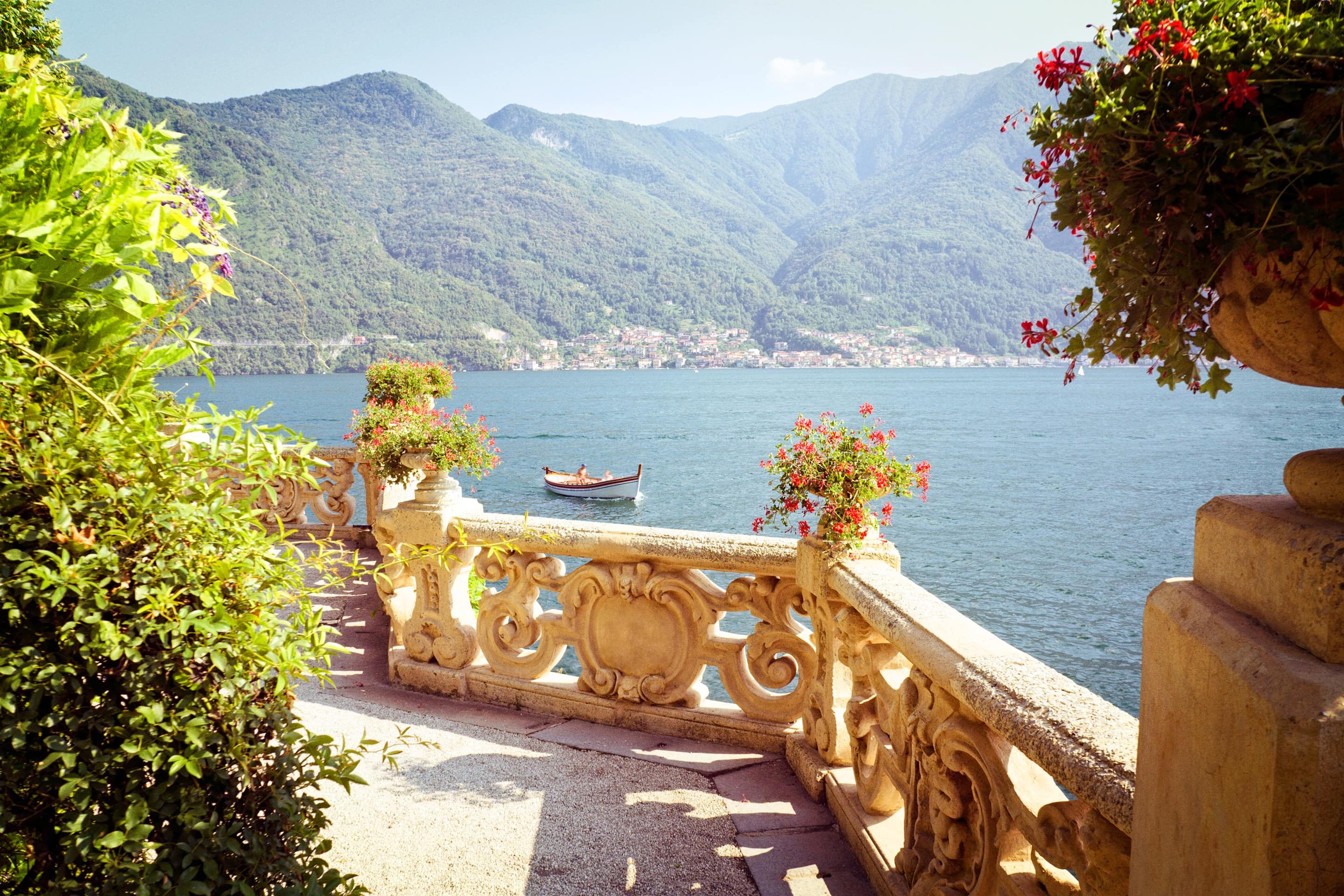 View of Lake Como from a sun-drenched patio
