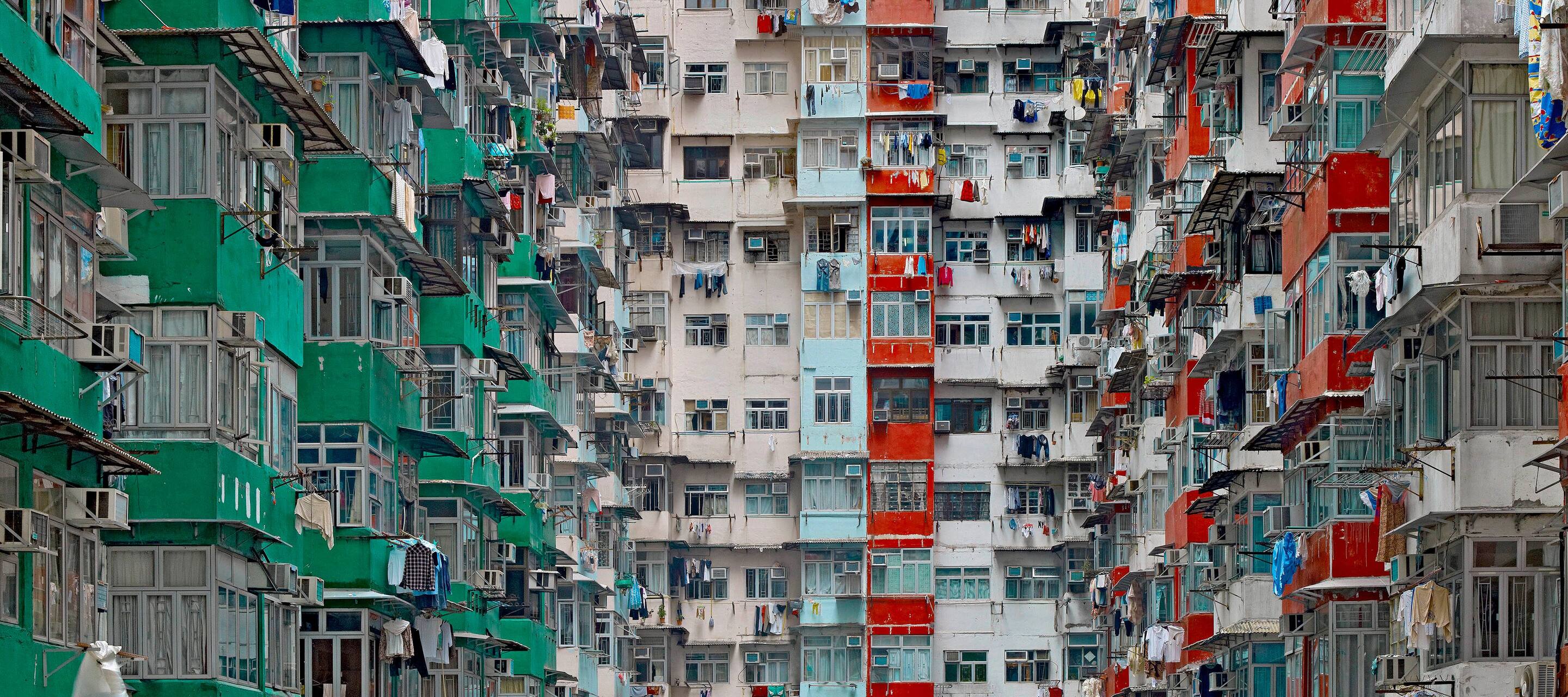 The multicoloured high-rise flats of Hong Kong with green, red and blue balconies