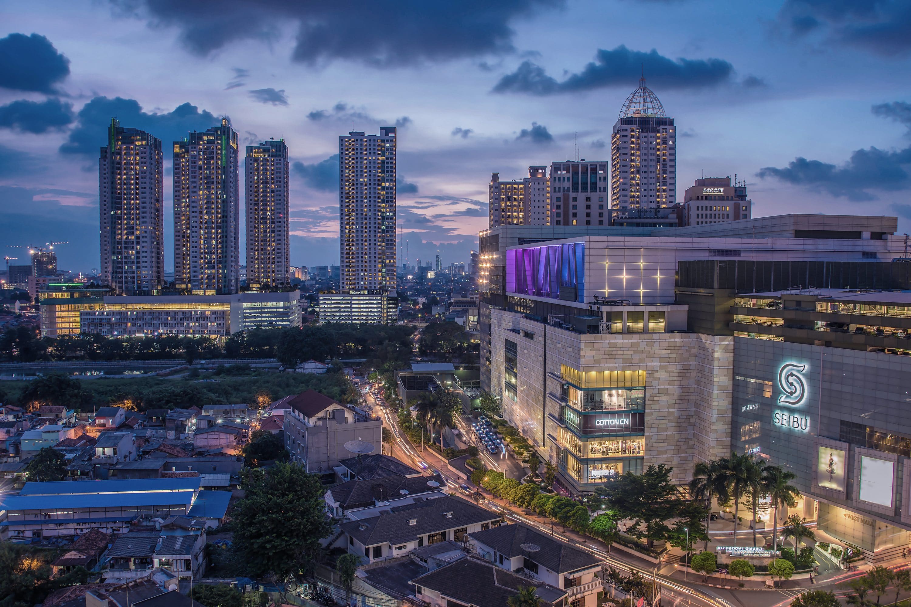 Grand Indonesia shopping centre at night, backdropped by the twinkling skyline