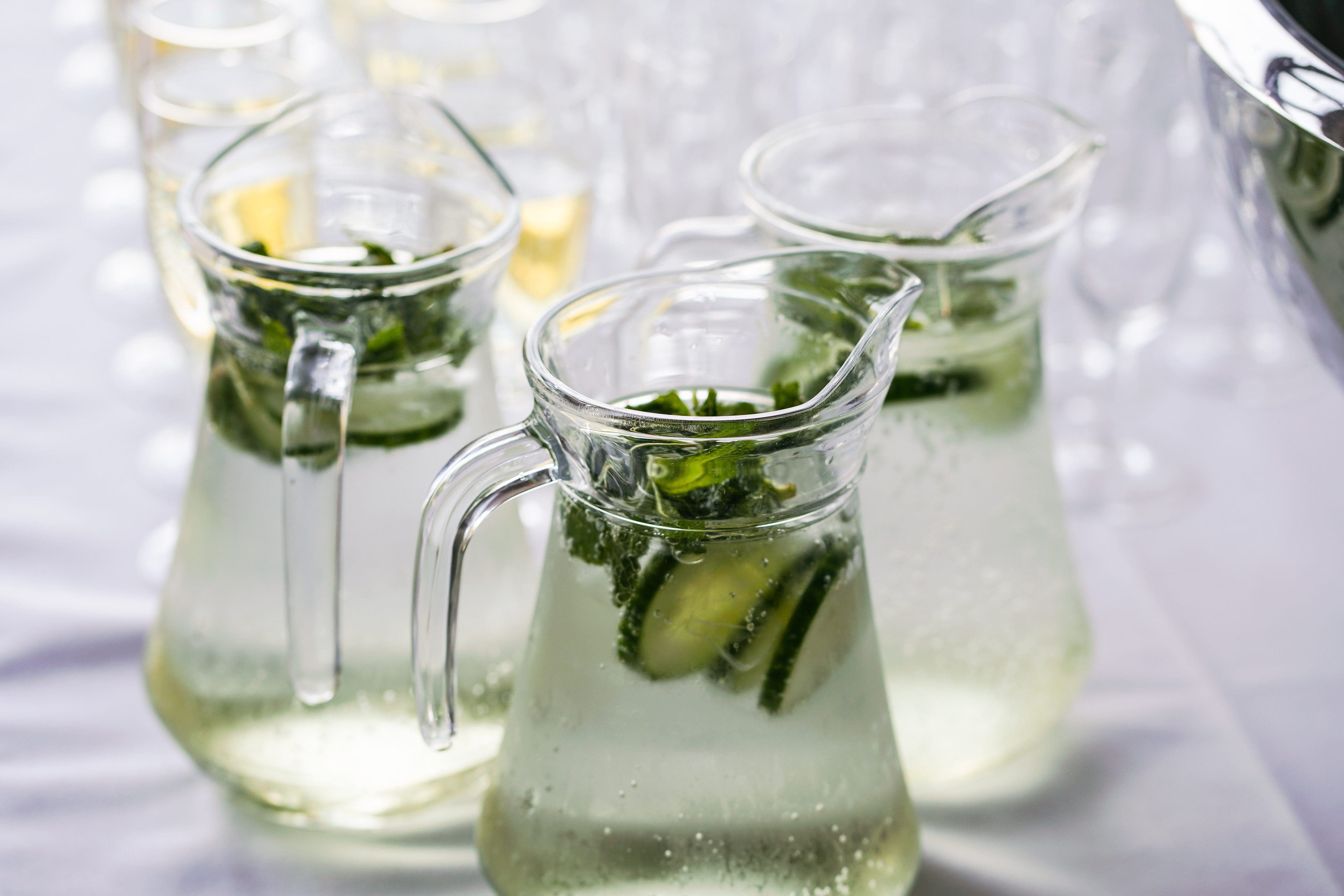 Jugs of cucumber-infused water