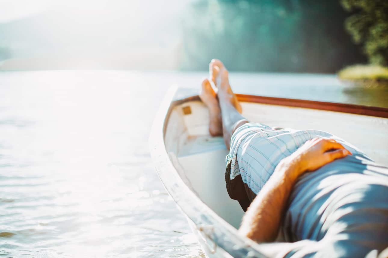 Man relaxing on a canoe
