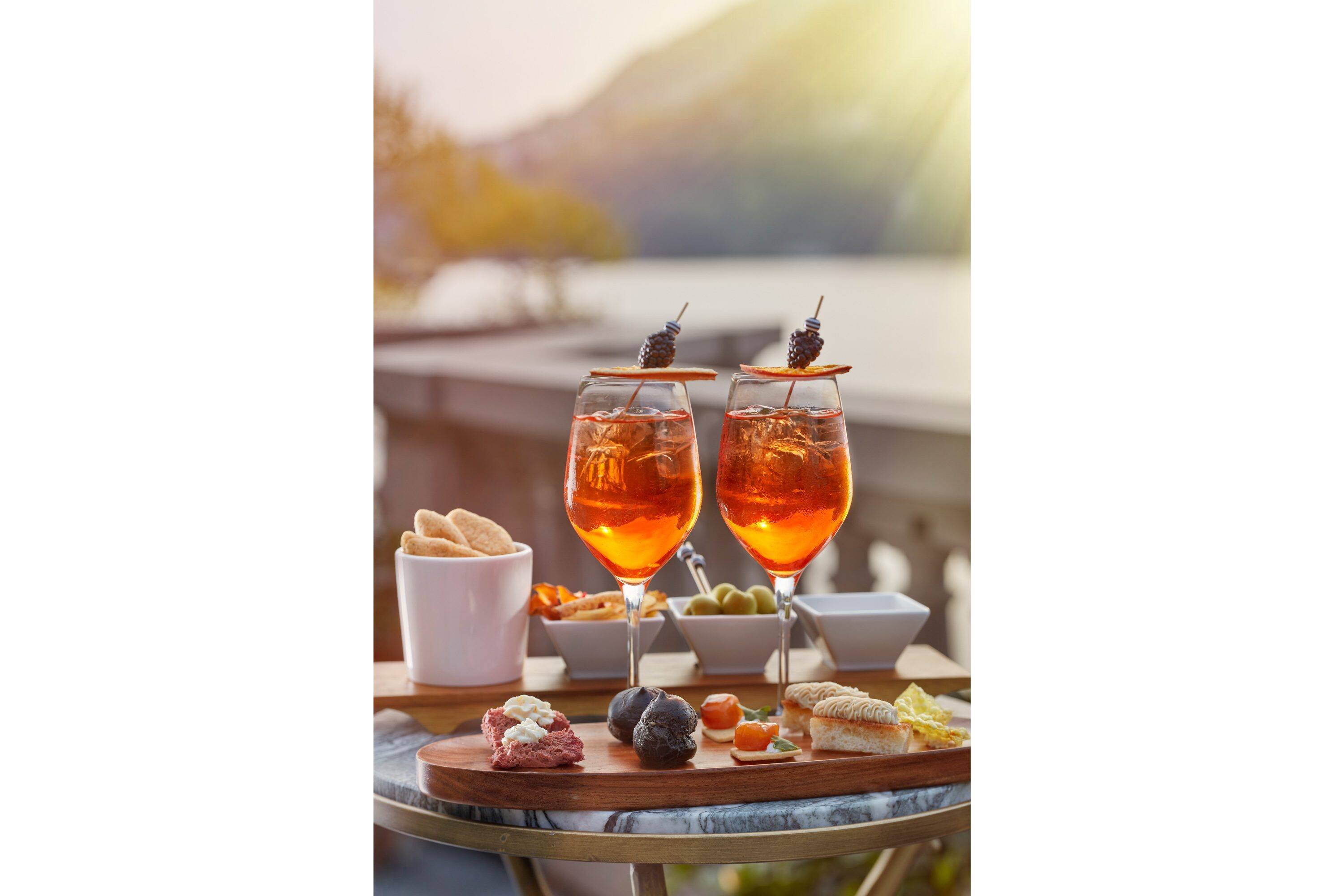 Campari sodas with a vista of Lake Como