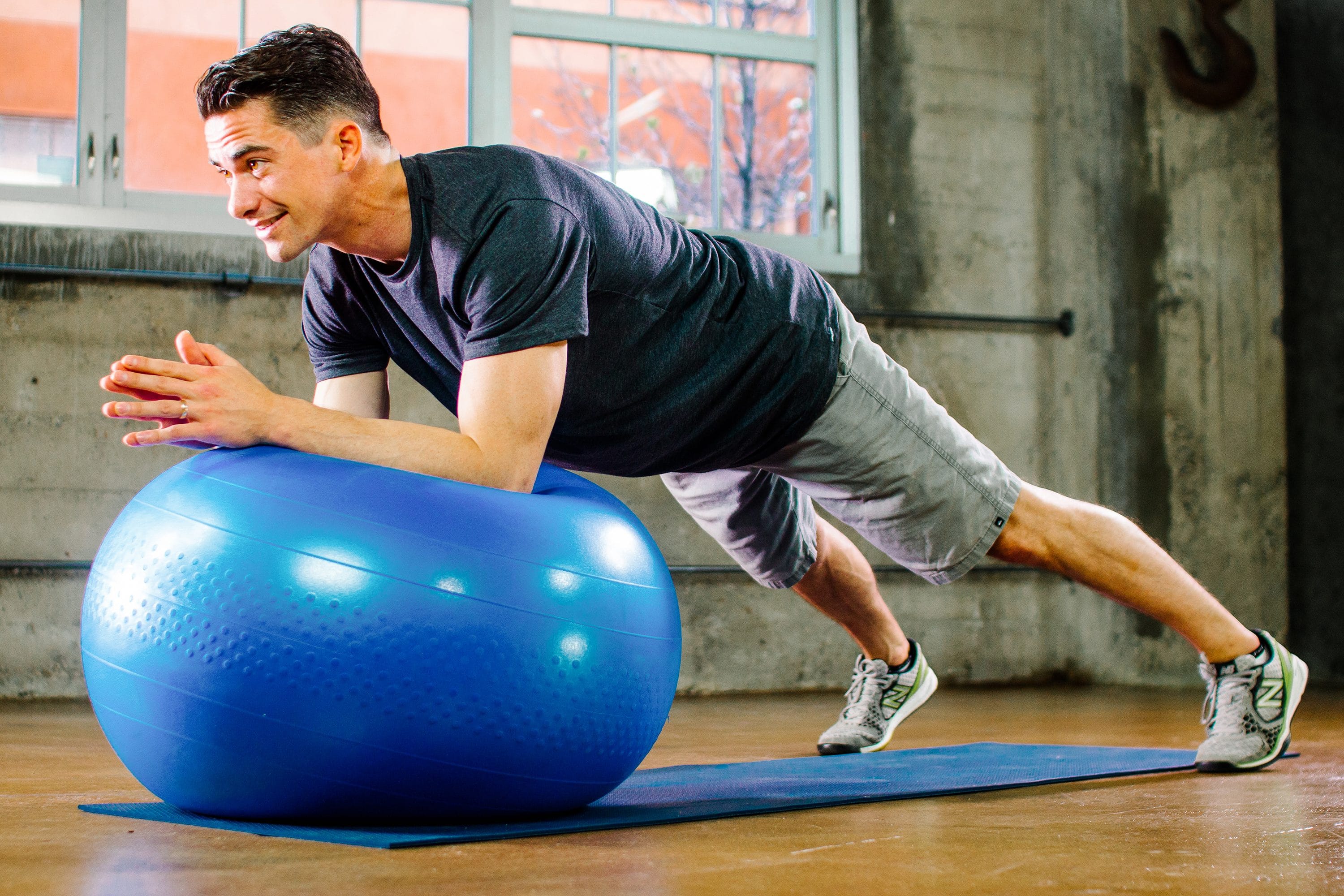 Sam Skelton exercising with a fit ball