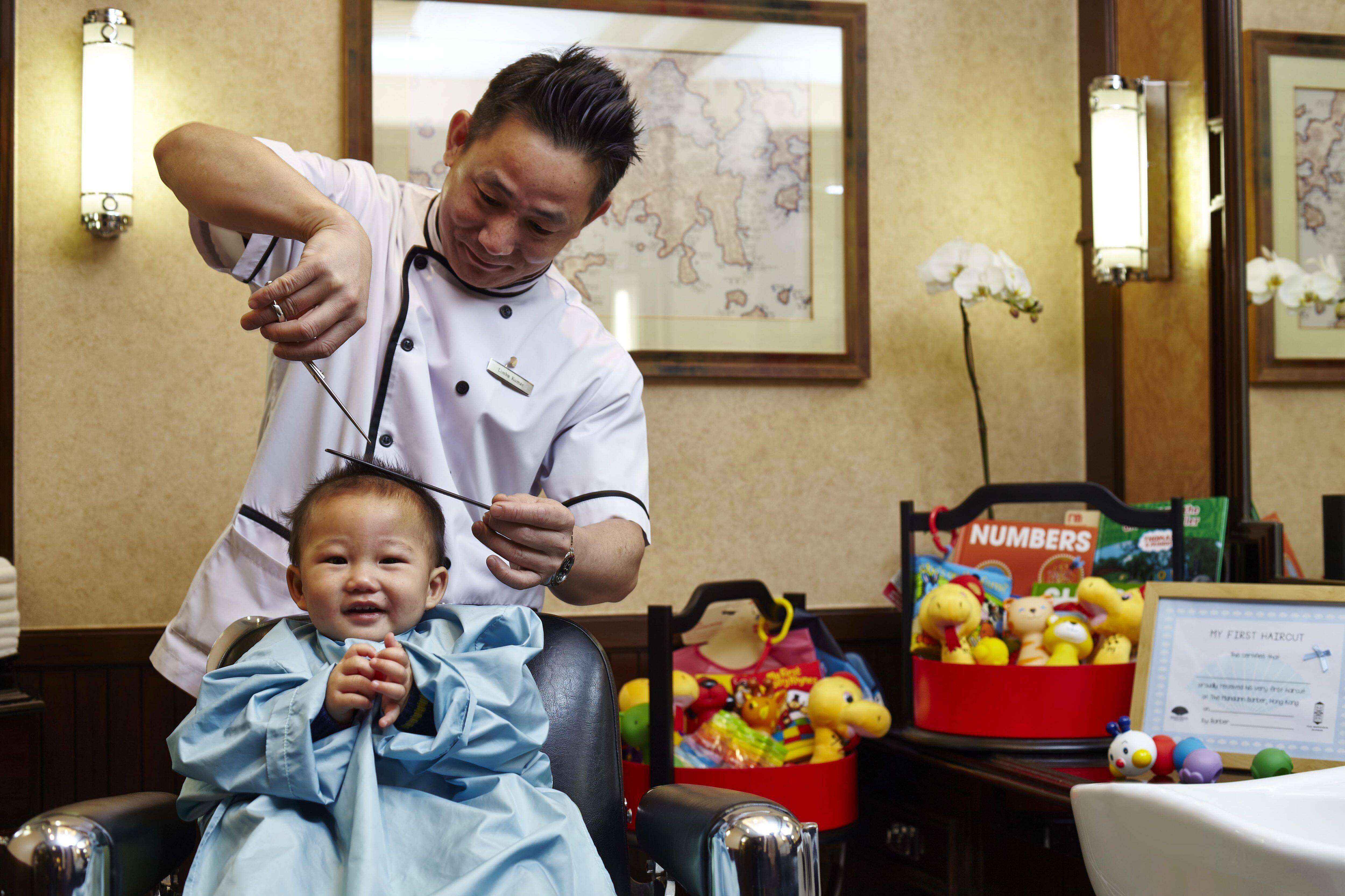 baby having first hair cut