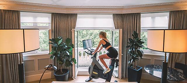 lady doing bike as in-room fitness 