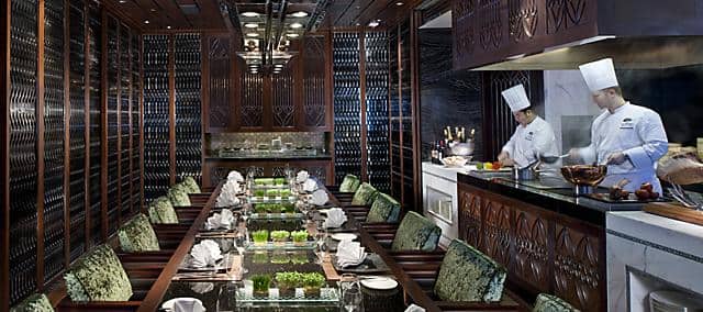 private dining table with chefs preparing food at mandarin oriental, macau