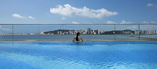 panorama city view from swimming pool at mandarin oriental, macau