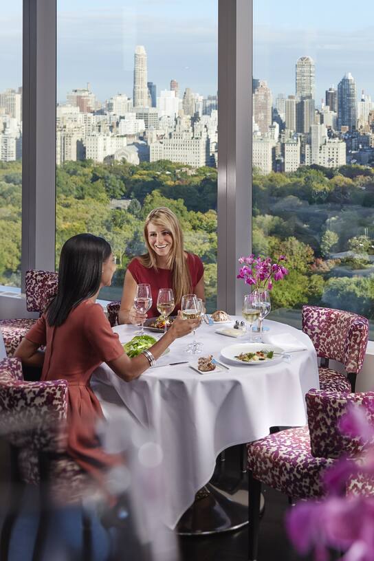 dining beside the window of Asiate looking over central park